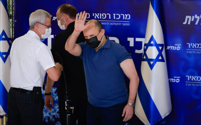 Prime Minister Naftali Bennett receives a COVID-19 vaccine booster shot at Meir Medical Center in Kfar Saba, on August 20, 2021. (Olivier Fitoussi/Flash90) Prime Minister Naftali Bennett receives a COVID-19 vaccine booster shot at Meir Medical Center in Kfar Saba, on August 20, 2021. (Olivier Fitoussi/Flash90)