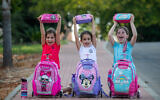 Yahli, Shachar, and Rumi, who will begin school in the upcoming academic school year, seen in Moshav Yashresh, on August 28, 2021. (Yossi Aloni/Flash90)