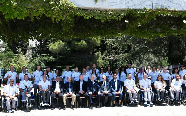 Israel's Paralympic delegation to Tokyo poses for a photo with then-president Reuven Rivlin on June 23, 2021, in Jerusalem. (Amos Ben Gershom/GPO)