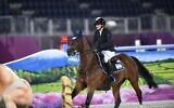 Israel's Ashlee Bond riding Donatello 141 competes in the equestrian's jumping individual final during the Tokyo 2020 Olympic Games at the Equestrian Park in Tokyo on August 4, 2021. (Amit Shissel/Israel Olympic Committee)