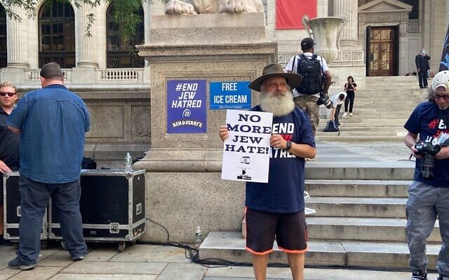 A pro-Israel demonstrator outside the New York Public Library in Manhattan on August 12, 2021. (Jacob Magid/Times of Israel)
