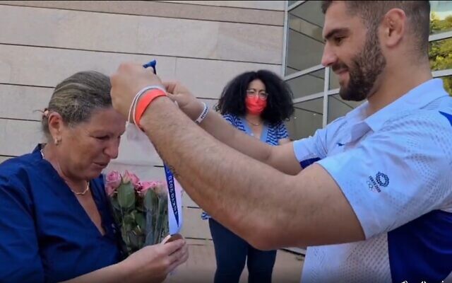 Screen capture from video of judoka Peter Paltchick presenting his mother Larissa with the bronze medal he won at the Tokyo Olympic Games, August 2, 2021. (Instagram) Screen capture from video of judoka Peter Paltchick presenting his mother Larissa with the bronze medal he won at the Tokyo Olympic Games, August 2, 2021. (Instagram)