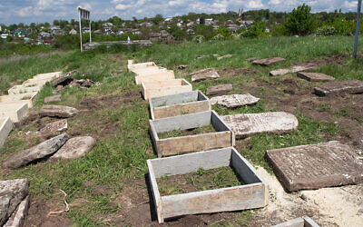 Renovation work at the Jewish cemetery in Sataniv, Ukraine, in 2021. (Dmitry Polyukhovich/Jewish Heritage Europe via JTA)