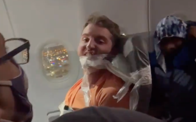 Maxwell Berry after being duct-taped to his chair on a Frontier Airlines flight to Miami in July 2021. (Screen capture/Twitter) Maxwell Berry after being duct-taped to his chair on a Frontier Airlines flight to Miami in July 2021. (Screen capture/Twitter)