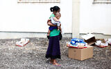 An Israeli woman outside a distribution center for needy people in Lod, September 11, 2012. Yonatan Sindel/Flash90)