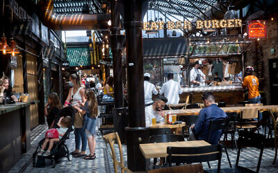 Customers at restaurants at the Sarona market in Tel Aviv on April 21, 2021. (Miriam Alster/Flash90) Customers at restaurants at the Sarona market in Tel Aviv on April 21, 2021. (Miriam Alster/Flash90)