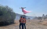 A firefighting plane works to extinguish a blaze near Jerusalem, August 25, 2021. (United Hatzala)