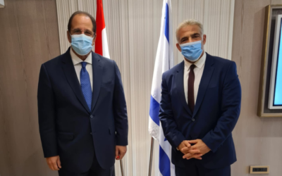Foreign Minister Yair Lapid (right) meets with Abbas Kamel, director of Egypt's General Intelligence Directorate, in Jerusalem on August 19, 2021. (Foreign Ministry)