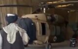 Taliban show off US-made Afghan military helicopters captured at Kandahar Airport, screen grab from video uploaded to Twitter on August 14, 2021.