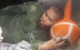 A wounded man wearing Afghani military uniform is treated by medics in Uzbekistan, August 15, 2021. (Video screenshot / Twitter)