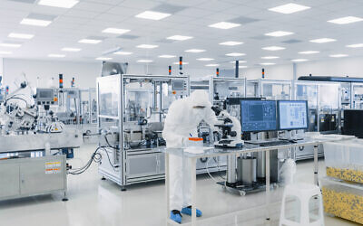An illustrative photo of a scientist in protective gear working in a lab.  (gorodenkoff via iStock by Getty Images)