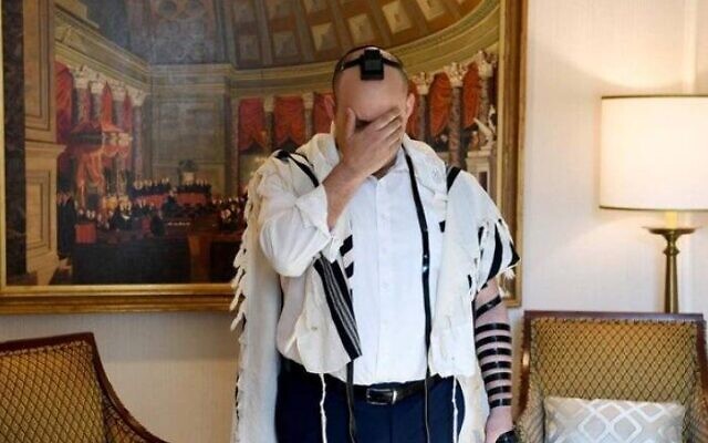 Prime Minister Naftali Bennett recites morning prayers at his hotel in Washington on August 25, 2021. (Avi Ohayon/GPO) Prime Minister Naftali Bennett recites morning prayers at his hotel in Washington on August 25, 2021. (Avi Ohayon/GPO)