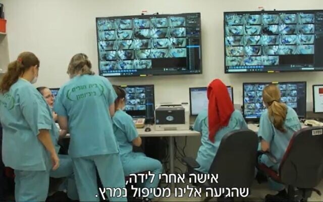 Nurses monitor patients in the coronavirus ward at Petah Tikva's Beilinson Medical Center (Screencapture/Channel 12)