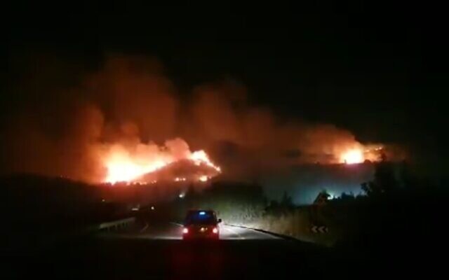 Fires are seen on the Ramim Ridge near Kiryat Shmona, on the Israel-Lebanon border, late on August 4, 2021. (screen capture: Twitter) Fires are seen on the Ramim Ridge near Kiryat Shmona, on the Israel-Lebanon border, late on August 4, 2021. (screen capture: Twitter)