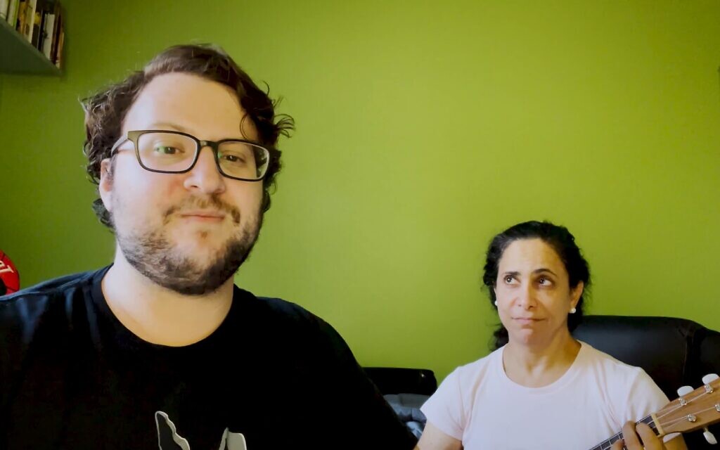Avishai and Naomi Weinberger sing 'The Anti-Vaxxer's Lament,' a satirical response to activists comparing COVID restrictions to the Holocaust. (YouTube screenshot) Avishai and Naomi Weinberger sing 'The Anti-Vaxxer's Lament,' a satirical response to activists comparing COVID restrictions to the Holocaust. (YouTube screenshot)