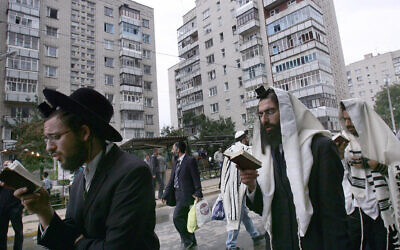File: Jews pray on a street near the tomb of Rabbi Nachman of Breslov in Uman, Ukraine, September 20, 2006. (Menahem Kahana/AFP)