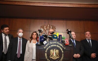Secretary-General of the Syrian-Lebanese Higher Council, Nasri Khoury, speaks during a joint press conference with Syrian Foreign Minister Faisal Miqdad (2nd right) and other cabinet members alongside his Lebanese counterpart Zeina Akar (3rd left) leading an official delegation, following a meeting in the capital Damascus, on September 4, 2021. (Louai Beshara/AFP)