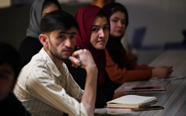 Students attend their class after private universities were reopened in Kabul on September 6, 2021. (Aamir Qureshi/AFP) Students attend their class after private universities were reopened in Kabul on September 6, 2021. (Aamir Qureshi/AFP)