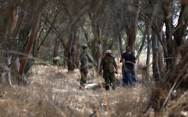 Members of Israeli security forces search a woodland area between the northern Israeli cities of Afula and Nazareth, on September 11, 2021, amid a manhunt for Palestinian jailbreakers. (Ahmad Gharabli/AFP) Members of Israeli security forces search a woodland area between the northern Israeli cities of Afula and Nazareth, on September 11, 2021, amid a manhunt for Palestinian jailbreakers. (Ahmad Gharabli/AFP)