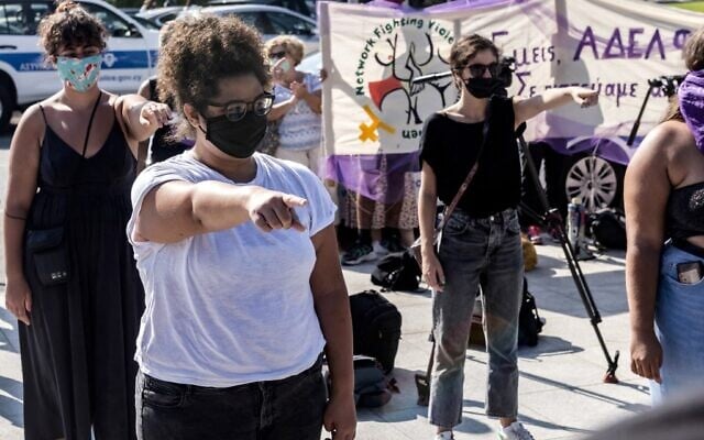 Cypriot women demonstrate on September 16, 2021 in front of Nicosia's supreme court, in support of a young British woman who alleged she was raped by up to 12 Israelis in a hotel room in the seaside party resort of Ayia Napa in July 2019. (Iakovos Hatzistavrou/AFP) Cypriot women demonstrate on September 16, 2021 in front of Nicosia's supreme court, in support of a young British woman who alleged she was raped by up to 12 Israelis in a hotel room in the seaside party resort of Ayia Napa in July 2019. (Iakovos Hatzistavrou/AFP)