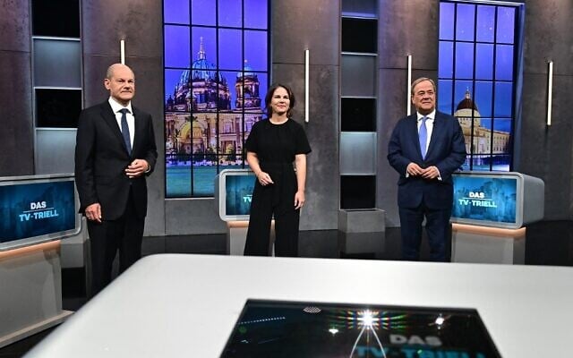 Top candidates for the upcoming German general elections (Left to right) Olaf Scholz of the Social Democrats SPD; Annalena Baerbock of Germany's Greens (Die Gruenen); and Armin Laschet of the conservative CDU-CSU party union pose for pictures before a "Triell" television debate, on September 19, 2021, in Berlin, ahead of Germany's general elections scheduled for September 26. (Tobias Schwarz/AFP) Top candidates for the upcoming German general elections (Left to right) Olaf Scholz of the Social Democrats SPD; Annalena Baerbock of Germany's Greens (Die Gruenen); and Armin Laschet of the conservative CDU-CSU party union pose for pictures before a "Triell" television debate, on September 19, 2021, in Berlin, ahead of Germany's general elections scheduled for September 26. (Tobias Schwarz/AFP)