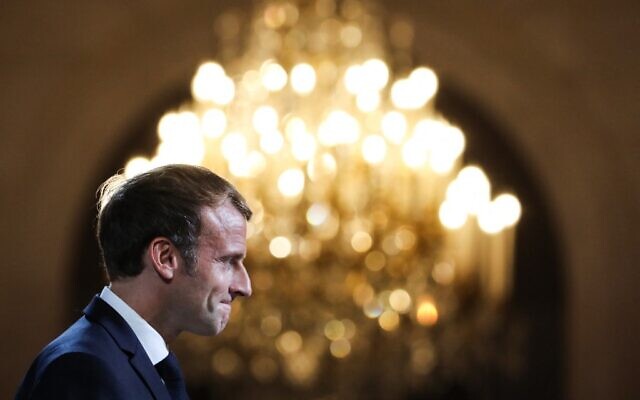 French President Emmanuel Macron reacts during a collective award ceremony for the Legion of Honor, at the Elysee Palace, in Paris, on September 20, 2021. (Stefano rellandini / POOL / AFP) French President Emmanuel Macron reacts during a collective award ceremony for the Legion of Honor, at the Elysee Palace, in Paris, on September 20, 2021. (Stefano rellandini / POOL / AFP)
