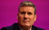 UK Labour Party leader Keir Starmer sits on stage during the opening day of the party's annual conference in Brighton, on the south coast of England, September 25, 2021. (Justin Tallis/AFP)