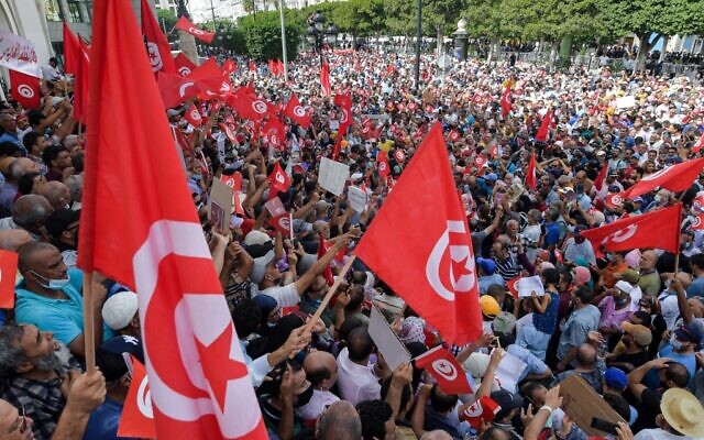 Demonstrators chant slogans during a protest in Tunisia's capital Tunis, on September 26, 2021, against President Kais Saied's recent steps to tighten his grip on power. (Fethi Belaid/AFP) Demonstrators chant slogans during a protest in Tunisia's capital Tunis, on September 26, 2021, against President Kais Saied's recent steps to tighten his grip on power. (Fethi Belaid/AFP)