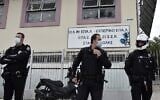 Police guard outside a vocational high school (EPAL) following clashes in the western suburb of Stavroupoli, in Thessaloniki, Greece, September 29, 2021. (Sakis Mitrolidis/AFP)