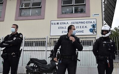 Police guard outside a vocational high school (EPAL) following clashes in the western suburb of Stavroupoli, in Thessaloniki, Greece, September 29, 2021. (Sakis Mitrolidis/AFP)