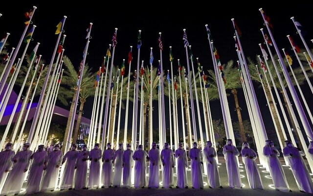Emirati men line up to welcome visitors the opening ceremony of the Dubai Expo 2020, on September 30, 2021. (Giuseppe Cacace/AFP)