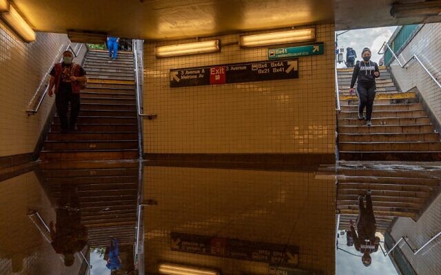 Commuters walk into a flooded 3rd Avenue / 149th st subway station and disrupted service due to extremely heavy rainfall from the remnants of Hurricane Ida on September 2, 2021, in New York City. (David Dee Delgado/Getty Images/AFP) Commuters walk into a flooded 3rd Avenue / 149th st subway station and disrupted service due to extremely heavy rainfall from the remnants of Hurricane Ida on September 2, 2021, in New York City. (David Dee Delgado/Getty Images/AFP)