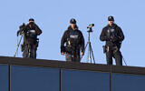 Illustrative: Police marksmen watch from the rooftop of the Christchurch High Court ahead of day two of the sentencing hearing of Australian Brenton Harrison Tarrant, in Christchurch, New Zealand, August 25, 2020. (AP Photo/Mark Baker)