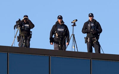 Illustrative: Police marksmen watch from the rooftop of the Christchurch High Court ahead of day two of the sentencing hearing of Australian Brenton Harrison Tarrant, in Christchurch, New Zealand, August 25, 2020. (AP Photo/Mark Baker)