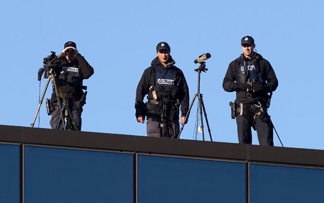 Illustrative: Police marksmen watch from the rooftop of the Christchurch High Court ahead of day two of the sentencing hearing of Australian Brenton Harrison Tarrant, in Christchurch, New Zealand, August 25, 2020. (AP Photo/Mark Baker) Illustrative: Police marksmen watch from the rooftop of the Christchurch High Court ahead of day two of the sentencing hearing of Australian Brenton Harrison Tarrant, in Christchurch, New Zealand, August 25, 2020. (AP Photo/Mark Baker)