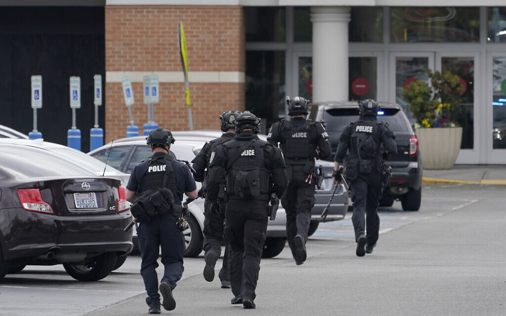 Illustrative -- Police officers jog toward an entrance at the Westfield Southcenter Mall after the shopping center was evacuated following a reported shooting, May 1, 2021, in Tukwila, Washington, south of Seattle. (AP Photo/Ted S. Warren) Illustrative -- Police officers jog toward an entrance at the Westfield Southcenter Mall after the shopping center was evacuated following a reported shooting, May 1, 2021, in Tukwila, Washington, south of Seattle. (AP Photo/Ted S. Warren)