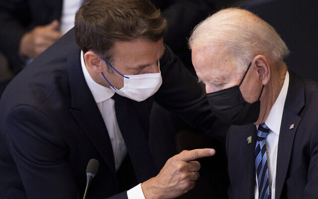 US President Joe Biden, right, speaks with French President Emmanuel Macron during a plenary session during a NATO summit at NATO headquarters in Brussels, June 14, 2021. (Brendan Smialowski, Pool via AP) US President Joe Biden, right, speaks with French President Emmanuel Macron during a plenary session during a NATO summit at NATO headquarters in Brussels, June 14, 2021. (Brendan Smialowski, Pool via AP)