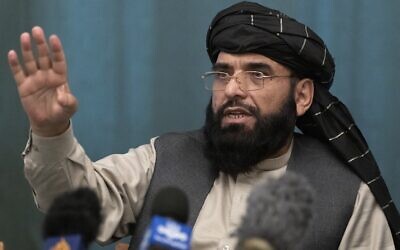 In this March 19, 2021 file photo, Suhail Shaheen, Afghan Taliban spokesman gestures while speaking during a joint news conference in Moscow, Russia.  (AP Photo/Alexander Zemlianichenko, Pool, File)