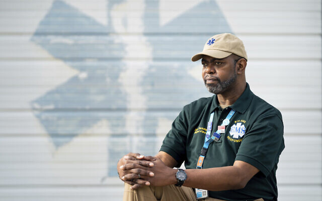 Guy Sanders poses for a portrait, Friday, Aug. 20, 2021, in Branchville, S.C. Sanders, originally from Brooklyn, N.Y., was an EMT who responded to the terrorist attacks on Sept. 11, 2001 and was on the scene when 7 World Trade Center collapsed. Sanders went to funeral after funeral for EMTs, firefighters and police to show appreciation for their sacrifice. (AP Photo/Sean Rayford)