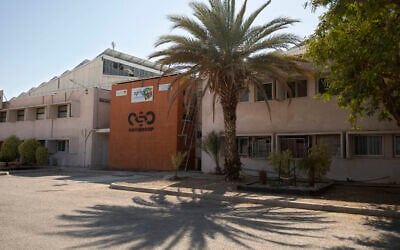 A logo adorns a wall on a branch of the Israeli NSO Group company, near the southern Israeli town of Sapir, on August 24, 2021. (AP/Sebastian Scheiner)