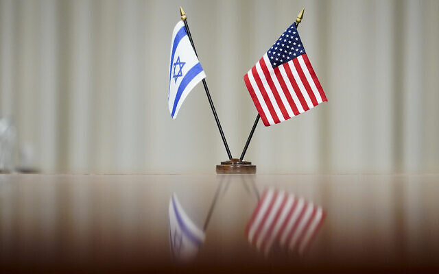 Illustrative: A flag of Israel and an American flag are displayed on a table during a meeting between Secretary of Defense Lloyd Austin and Prime Minister Naftali Bennett at the Pentagon in Washington, August 25, 2021. (AP Photo/Andrew Harnik) Illustrative: A flag of Israel and an American flag are displayed on a table during a meeting between Secretary of Defense Lloyd Austin and Prime Minister Naftali Bennett at the Pentagon in Washington, August 25, 2021. (AP Photo/Andrew Harnik)