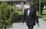 In this photo released by the official website of the office of the Iranian Presidency, Mohammad Eslami, walks in the presidency compound, April 7, 2021, in Tehran, Iran (Iranian Presidency Office via AP)