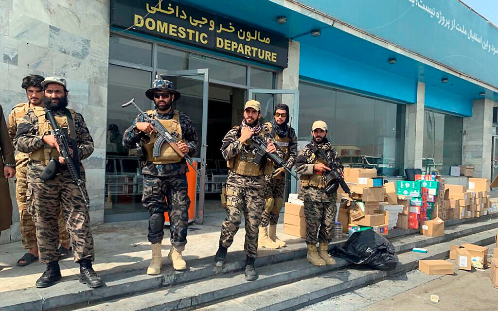 Taliban fighters stand guard inside the Hamid Karzai International Airport after the US withdrawal in Kabul, Afghanistan, August 31, 2021. (AP Photo/Kathy Gannon)