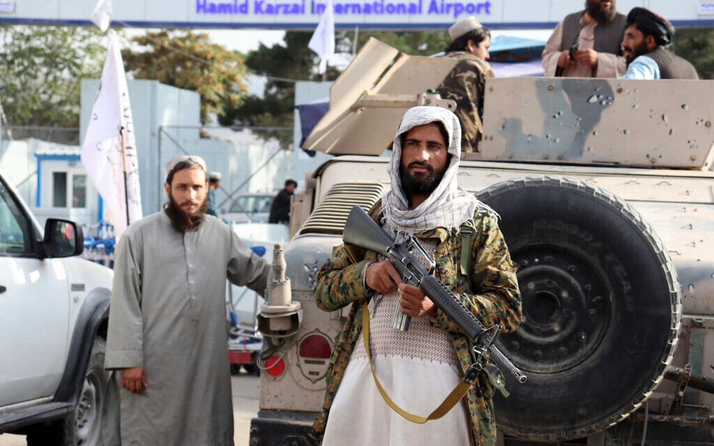 Taliban fighters stand guard in front of the Hamid Karzai International Airport after the US withdrawal in Kabul, Afghanistan, August 31, 2021. (AP Photo/Khwaja Tawfiq Sediqi)