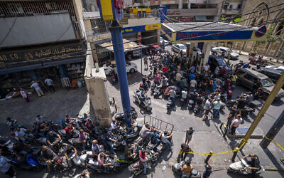 Motorcycle drivers wait to get fuel at a gas station in Beirut, Lebanon, Tuesday, Aug. 31, 2021. (AP/ Hassan Ammar)