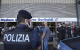 Illustrative: Italian police officers stand guard at Porta Garibaldi train station, in Milan, Italy, September 2, 2021. (Luca Bruno/AP)