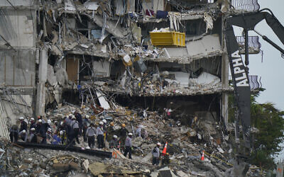 Search and rescue personnel work atop the rubble at the Champlain Towers South condo building in Surfside, Florida, on June 30, 2021. (AP Photo/Lynne Sladky)