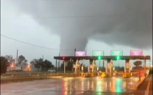 A fast-moving tornado is seen in the distance through a windshield just before the toll booth for the Burlington Bristol Bridge on September 1, 2021, in Burlington, New Jersey. (Scott Smith via AP) A fast-moving tornado is seen in the distance through a windshield just before the toll booth for the Burlington Bristol Bridge on September 1, 2021, in Burlington, New Jersey. (Scott Smith via AP)