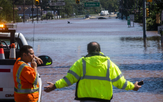 People take a look at the 206 route partially flooded as a result of the remnants of Hurricane Ida in Somerville, N.J., Thursday, Sept. 2, 2021. (AP/Eduardo Munoz Alvarez) People take a look at the 206 route partially flooded as a result of the remnants of Hurricane Ida in Somerville, N.J., Thursday, Sept. 2, 2021. (AP/Eduardo Munoz Alvarez)