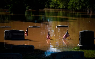Headstones at a cemetery that flooded in Somerville, N.J. September 2, 2021. (AP Photo/Eduardo Munoz Alvarez)